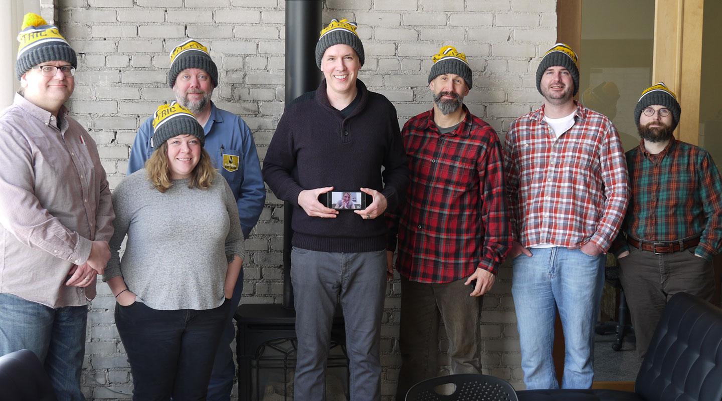 members of Electric Citizen, all wearing team hats