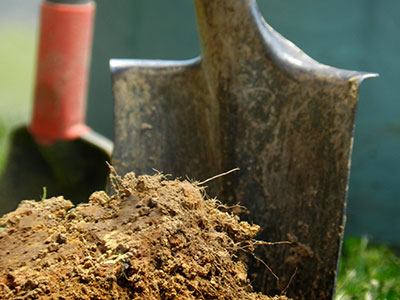 shovel digging into dirt