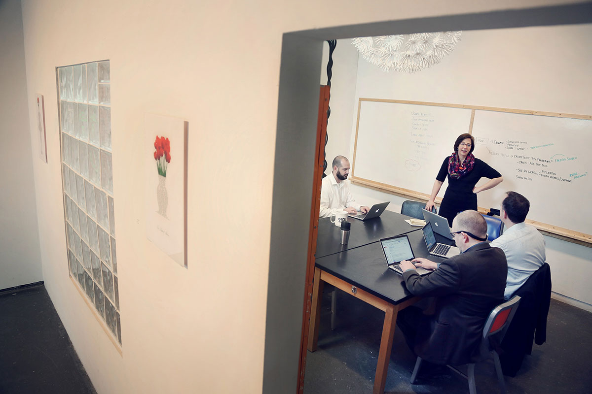 work team meeting in conference room as seen from the doorway