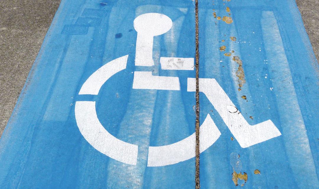 handicap symbol painted on a parking spot