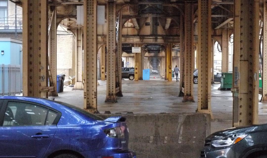 shot underneath the Chicago El subway system, with metal girders