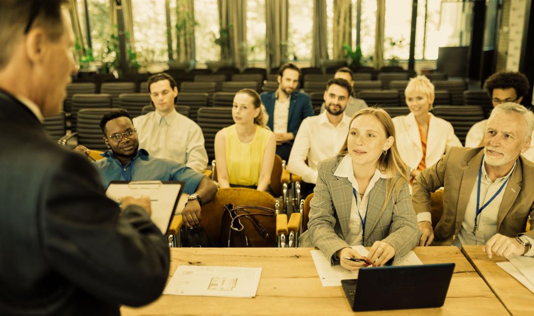 group of business professionals gathered in a conference room