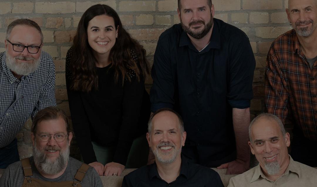 Electric Citizen team, gathered around a couch in an open loft space
