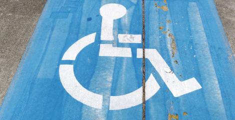 handicap symbol painted on a parking spot