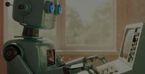retro looking, friendly robot typing on a computer