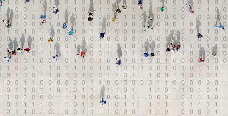 small people moving across a background of computer binary numbers