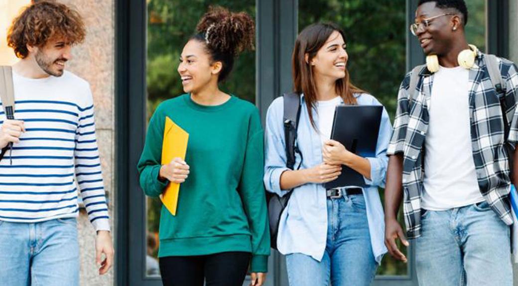 young adult college students talking together outside