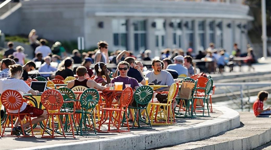people sitting at tables outside of the Wisconsin Union 