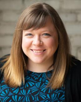 photo of aundrea billings wearing a blue and black top