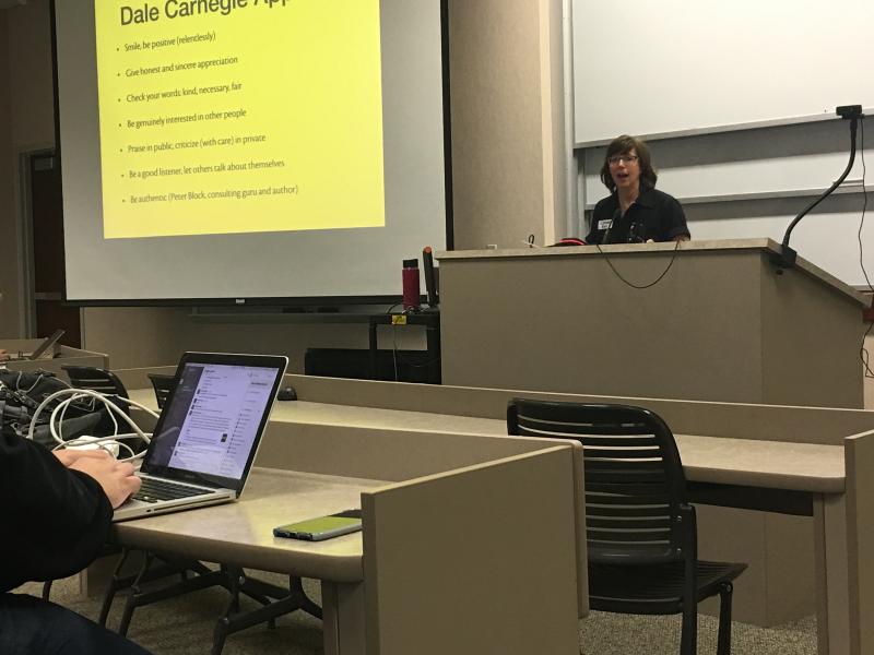 Keri at the lectern giving her presentation to audience