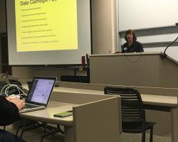 Keri at the lectern giving her presentation to audience