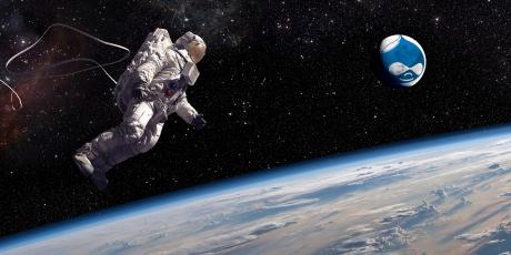astronaut in full suite doing a spacewalk with a Drupal planet nearby