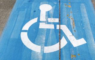 handicap symbol painted on a parking spot