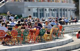 people sitting at tables outside of the Wisconsin Union 