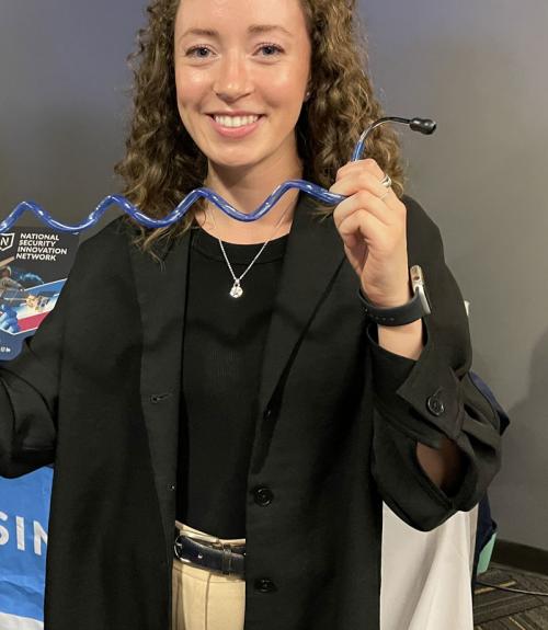 college student displaying their science work