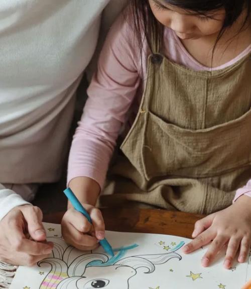 mother and daughter drawing together