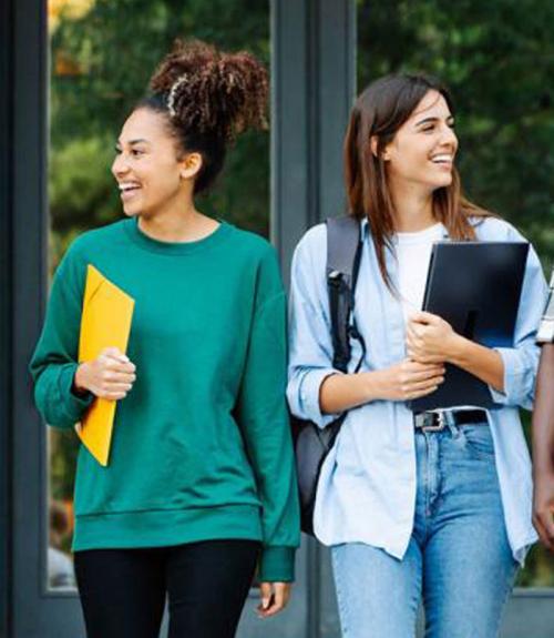 young adult college students talking together outside