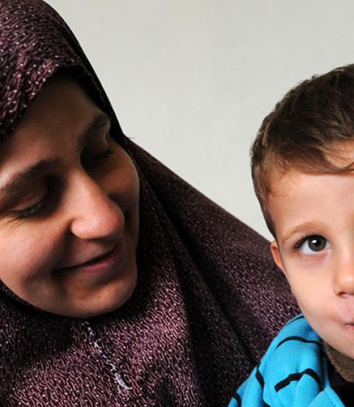 mother in headscarf with young boy