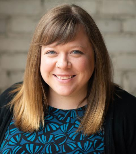 photo of aundrea billings wearing a blue and black top